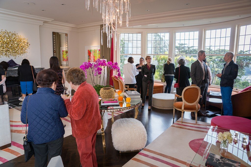 Group of people mingling at a luxury event