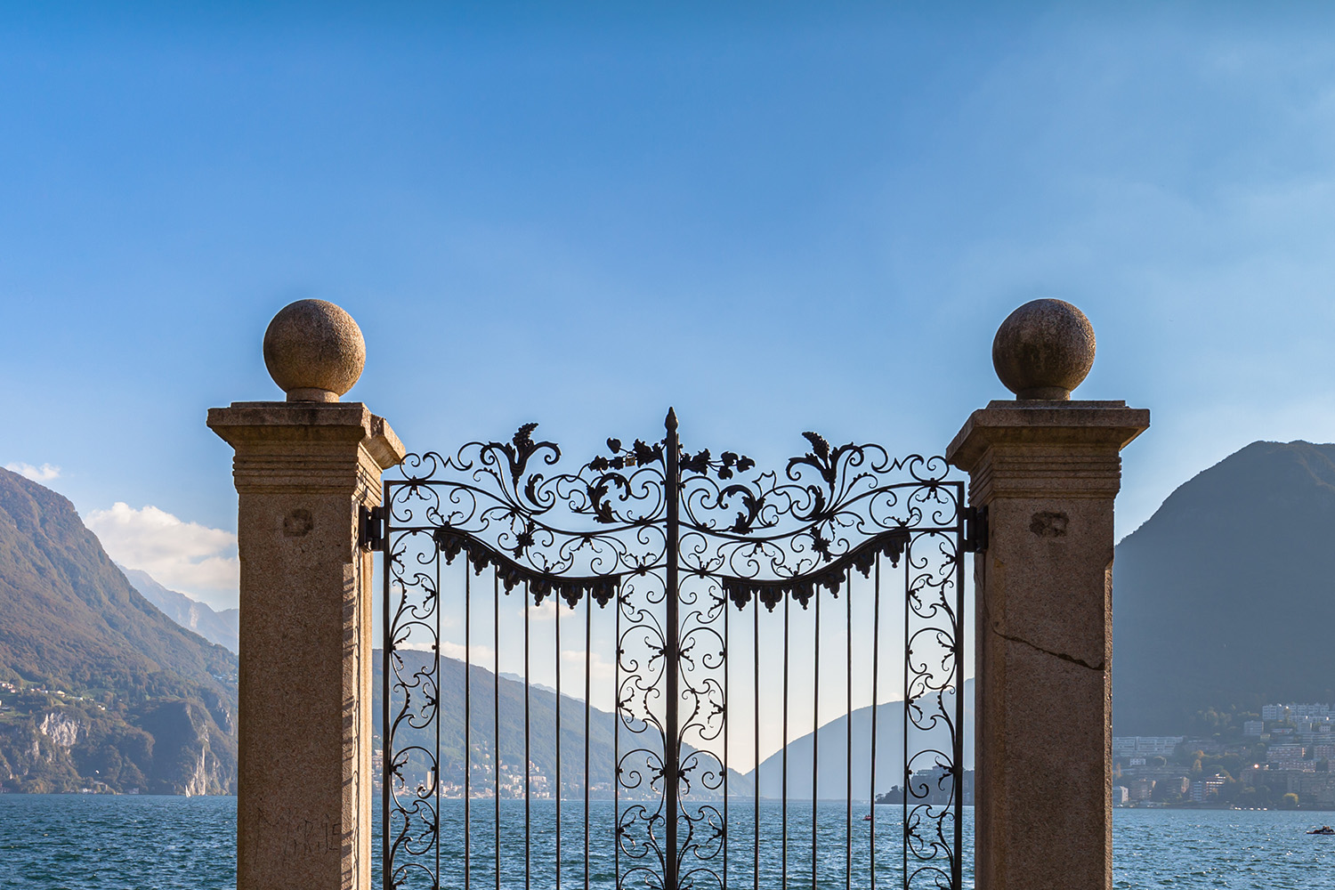 2 posts and luxury rod iron gate that opens to the ocean and mountains.
